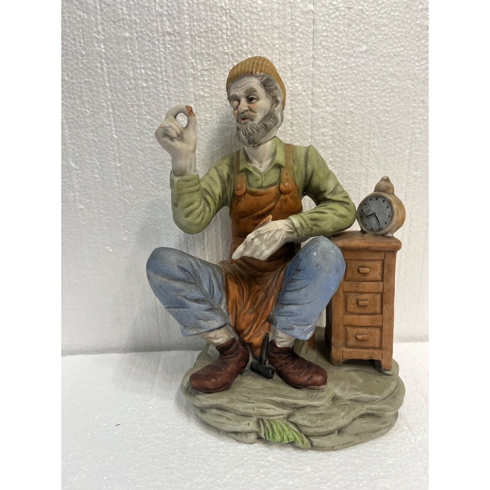 Vintage Taiwan‎ ceramic painted figurine of Man sitting on stone next to dresser